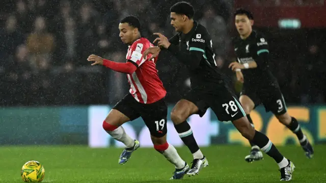 Southampton's Cameron Archer in action with Liverpool's Jarell Quansah