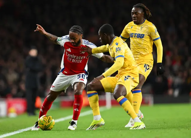 Raheem Sterling of Arsenal is challenged by Tyrick Mitchell of Crystal Palace