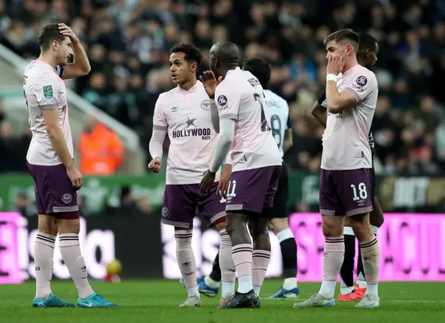 Brentford's Fabio Carvalho talks to teammates