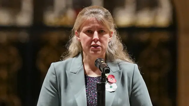 Labour's Rachael Maskell wearing a green blazer and speaking into a microphone