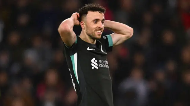 Diogo Jota of Liverpool react