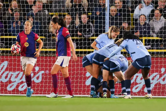 Manchester City celebrate scoring against Barcelona