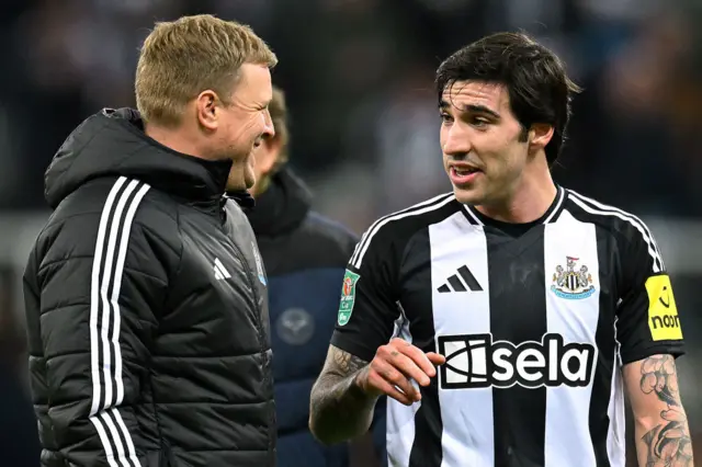 Eddie Howe, Manager of Newcastle United, and Sandro Tonali of Newcastle United react