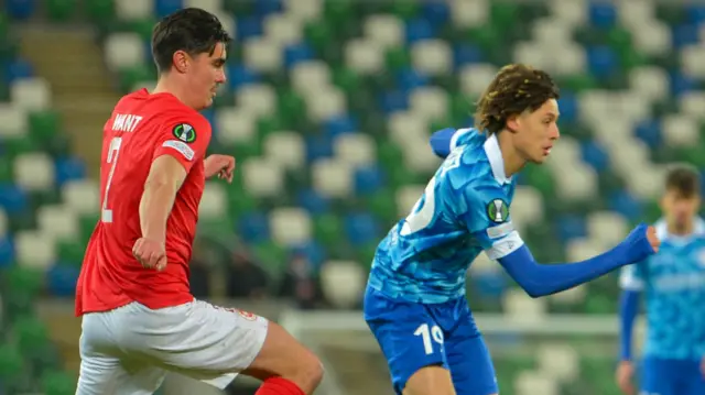 Shaun Want in action against Franck Surdez during the first half at Windsor Park