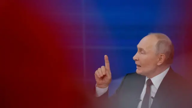 Putin points during a marathon length speech