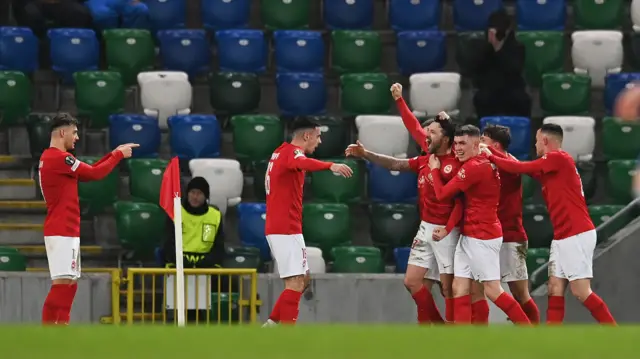 Tomas Cosgrove celebrating with his teammates after his goal