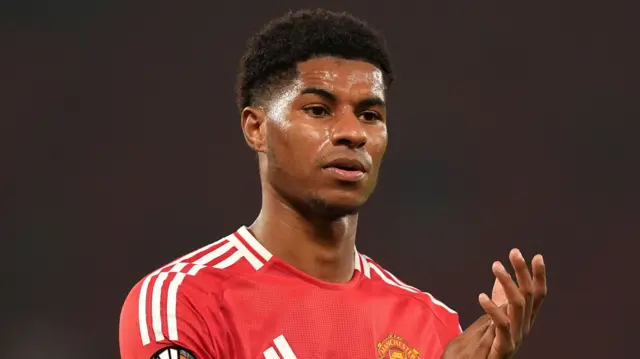 Marcus Rashford applauds Manchester United fans after a Europa League game