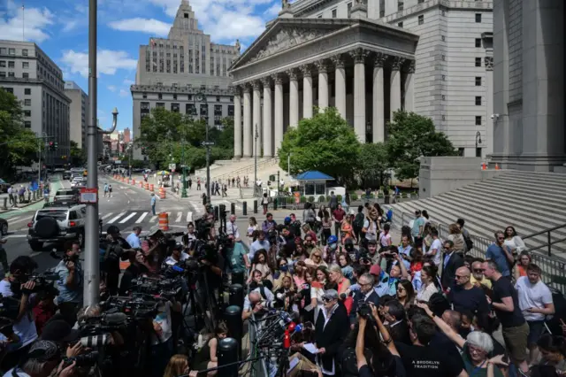 Members of the media gather around Ghislaine Maxwell's defense attorney Bobbi Sternheim