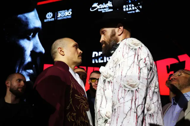 Oleksandr Usyk and Tyson Fury stand face-to-face