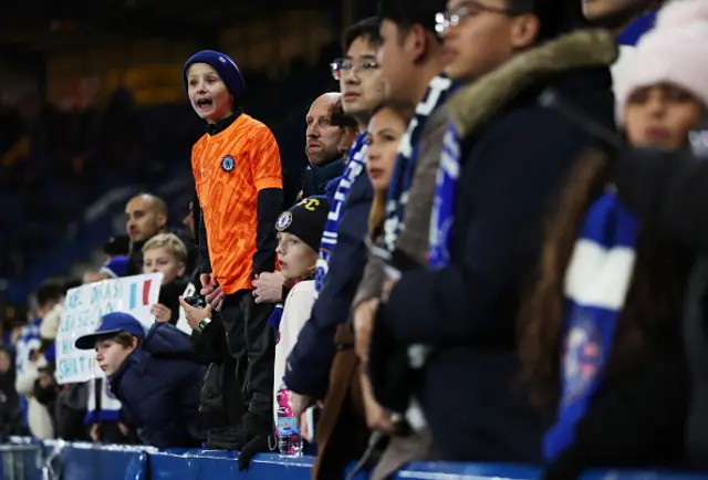 A young Chelsea fan shouts