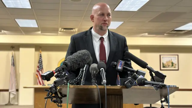 Blair County District Attorney Pete Weeks stands at a lectern