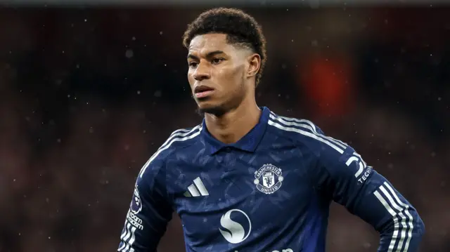 Marcus Rashford stood with his hands on his hips during a Manchester United game