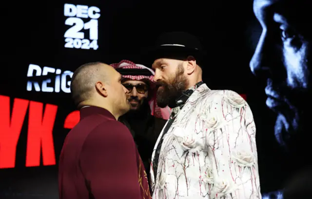 Oleksandr Usyk and Tyson Fury stand face-to-face