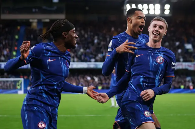 Cole Palmer celebrates with team-mates