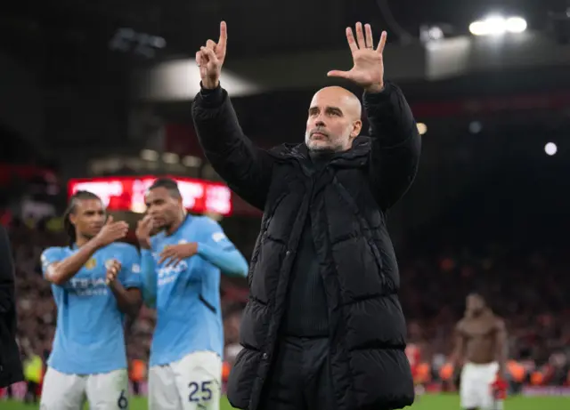 Manchester City manager Pep Guardiola holds up six fingers to the fans indicating the number of Premier League titles he has won