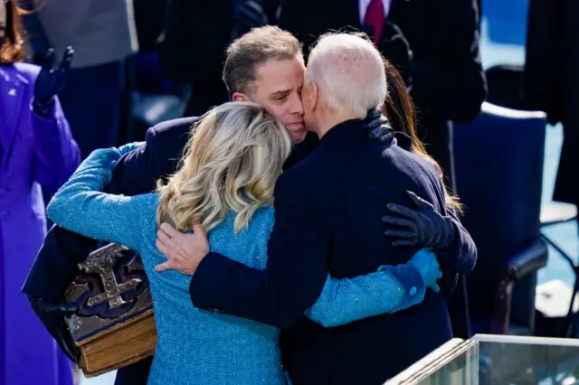 U.S. President Joe Biden embraces his family First Lady Dr. Jill Biden, son Hunter Biden and daughter Ashley