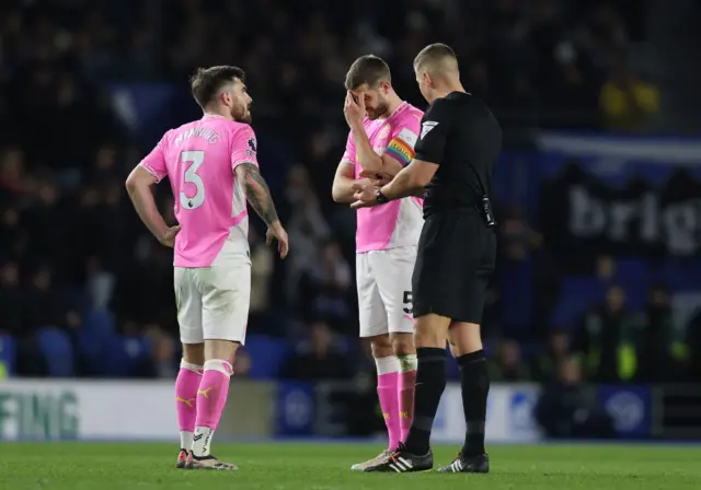 Referee Robert Jones explains to a disappointed looking Jack Stephens of Southampton why Cameron Archer's goal was disallowed