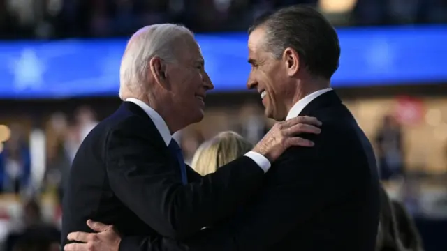 President Joe Biden (L) hugging his son Hunter (R) at the conclusion of the first day of the Democratic National Convention