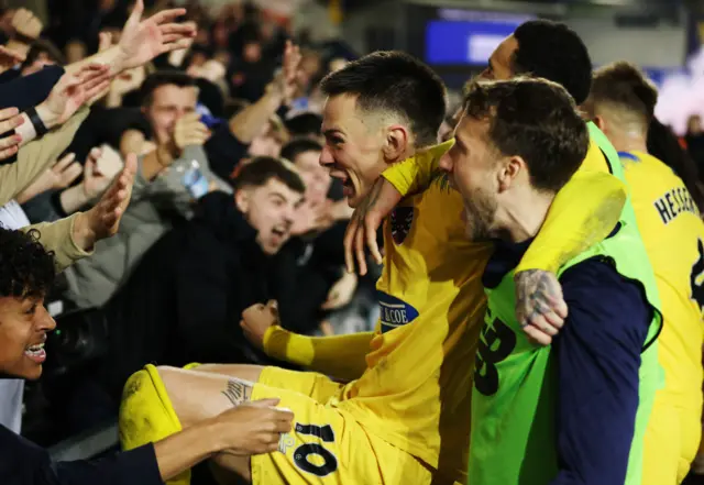 Ryan Alex Hill of Dagenham & Redbridge celebrates with the fans