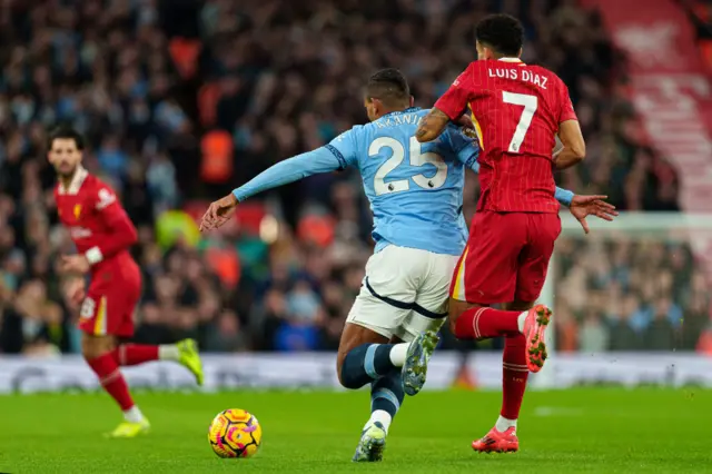 Manuel Akanji battles for possession with Liverpool's Luis Diaz