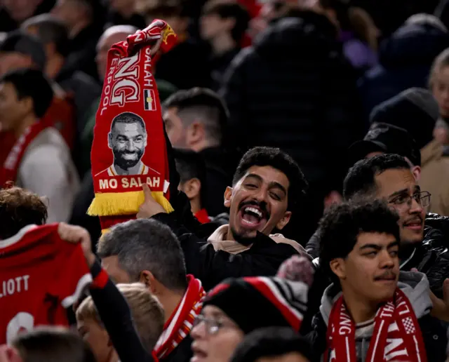 Mo Salah scarf being held up by a fan