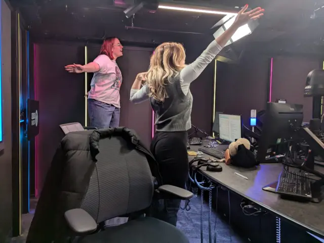 Women dancing on chairs