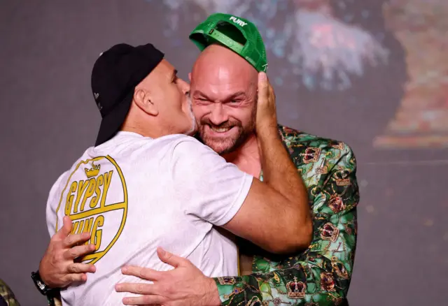 John Fury kisses Tyson Fury on the cheek