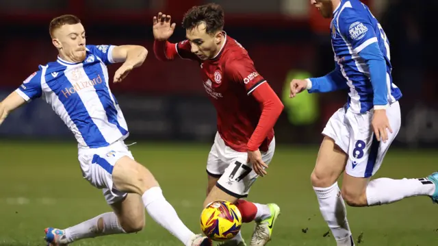 Crewe's Matus Holicek is tackled by Colchester's Arthur Read