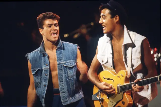 Wham performing on stage