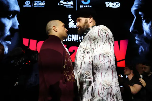 Oleksandr Usyk and Tyson Fury stand face-to-face