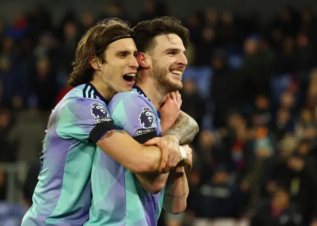 Riccardo Calafiori and Declan Rice celebrate.