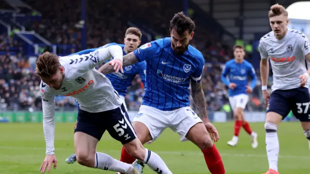 Norman Bassette and Marlon Pack battle for the ball