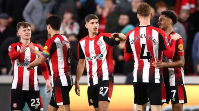 Brentford players celebrate after scoring a goal against Leicester in the Premier League