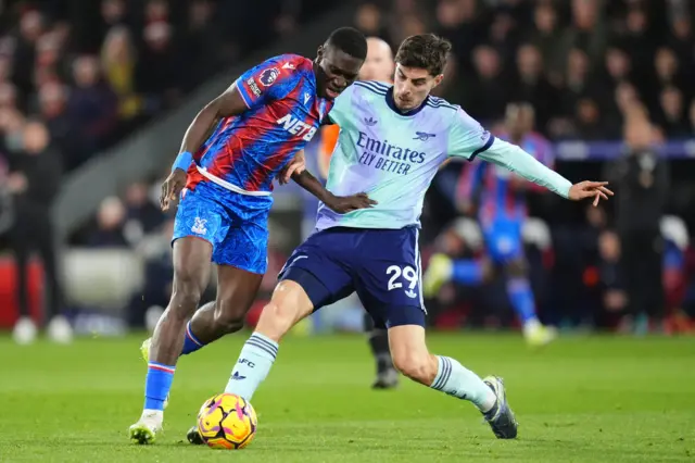 Crystal Palace's Ismaila Sarr is tackled by Arsenal’s Kai Havertz