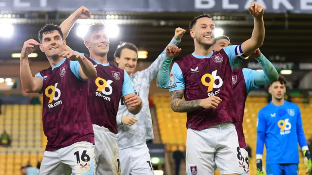 Burnley players celebrate after beating Norwich