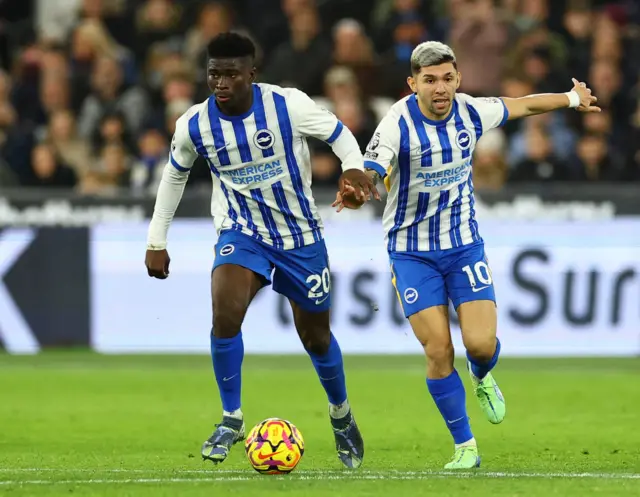 Brighton & Hove Albion's Carlos Baleba and Julio Enciso in action