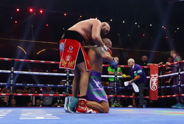 Tyson Fury hugs Oleksandr Usyk after their fight