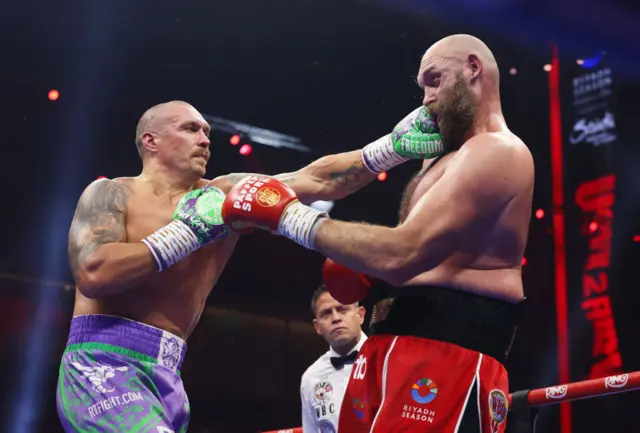 Oleksandr Usyk jabs Tyson Fury