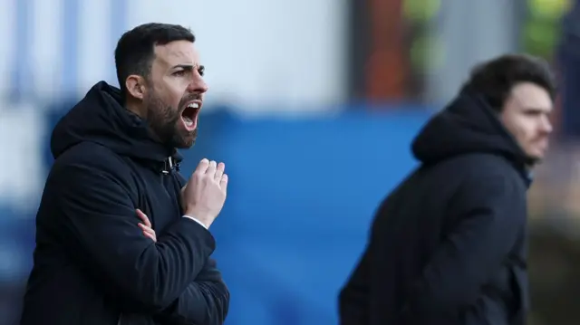 Stoke manager Narcis Pelach and Sheff Wed manager Danny Rohl on the touchline