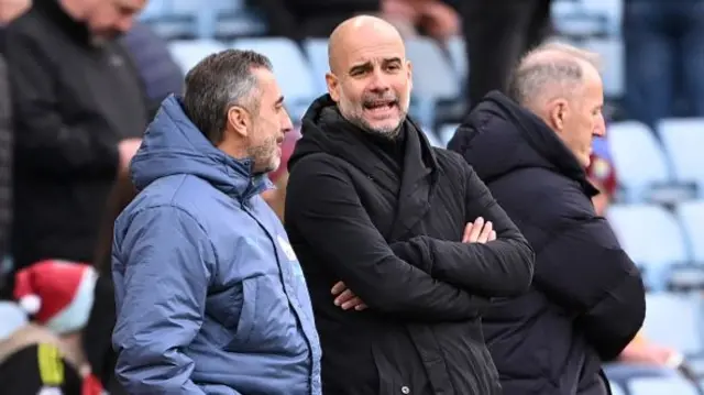 Pep Guardiola, Manager of Manchester City, interacts with Manel Estiarte