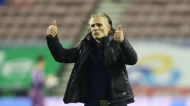 Gareth Ainsworth gives the thumbs up to Shrewsbury fans after the 2-2 draw at Wigan