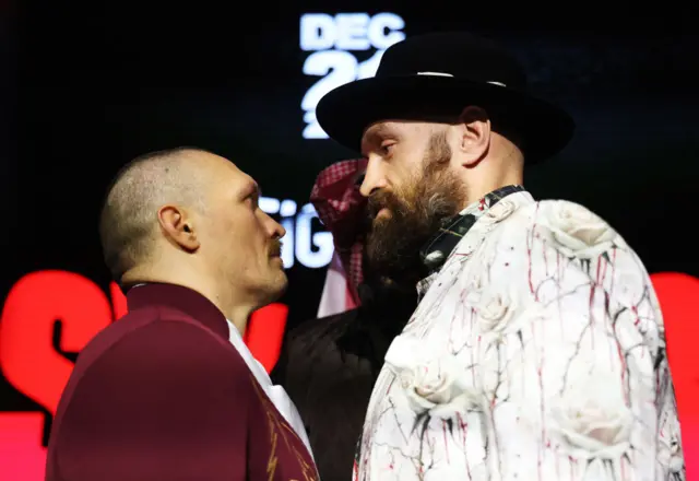 Oleksandr Usyk and Tuson Fury stare at each other