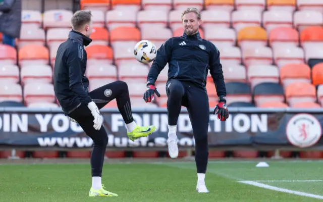 Celtic goalkeepers Kasper Schmeichel (right) and Viljami Sinisalo warming up