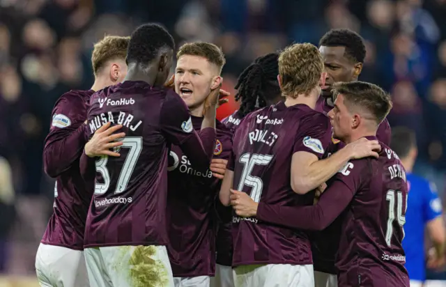 Blair Spittal celebrates with teammates after scoring the winner