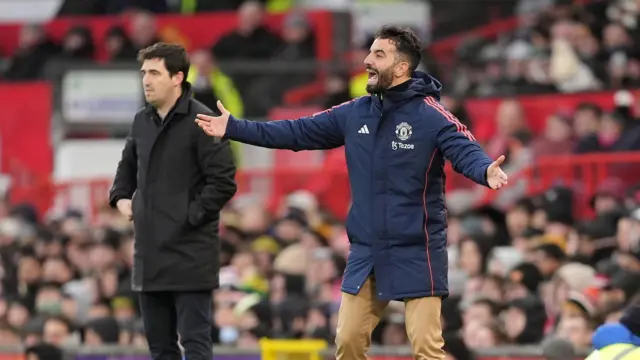 Manchester United manager Ruben Amorim (right) reacts on the touchline