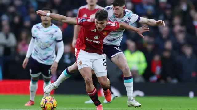 Manchester United's Manuel Ugarte in action with AFC Bournemouth's Ryan Christie