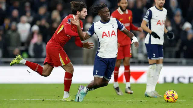 Liverpool's Dominik Szoboszlai fouls Tottenham Hotspur's Yves Bissouma