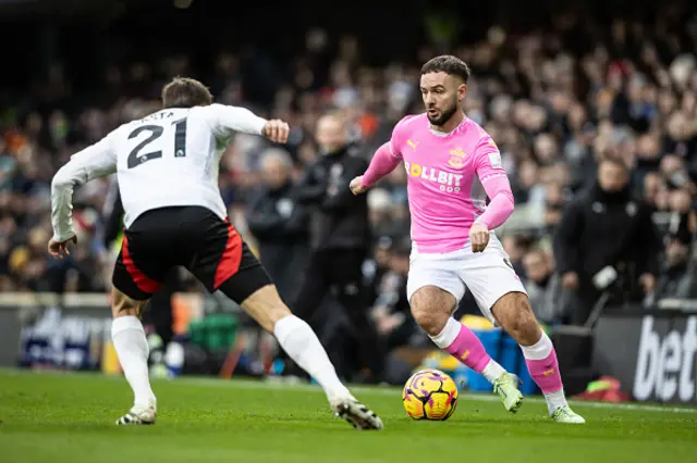 Fulham's Timothy Castagne competing with Southampton's Adam Armstrong