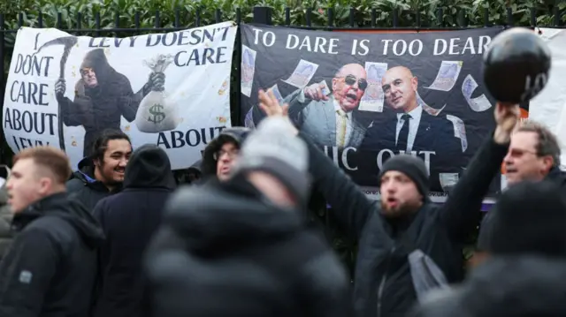 Fans protest owner Daniel Levy outside the Spurs stadium before Liverpool