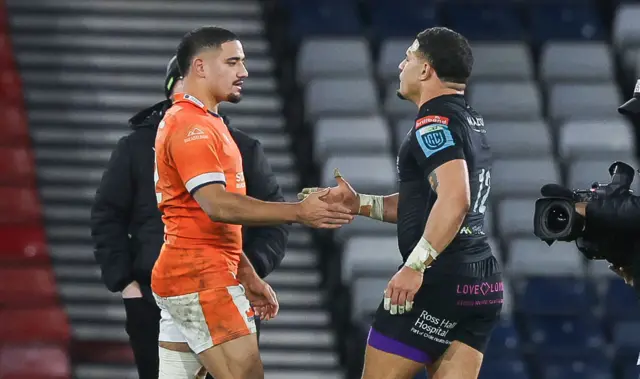 The Tuipulotu brothers shake hands